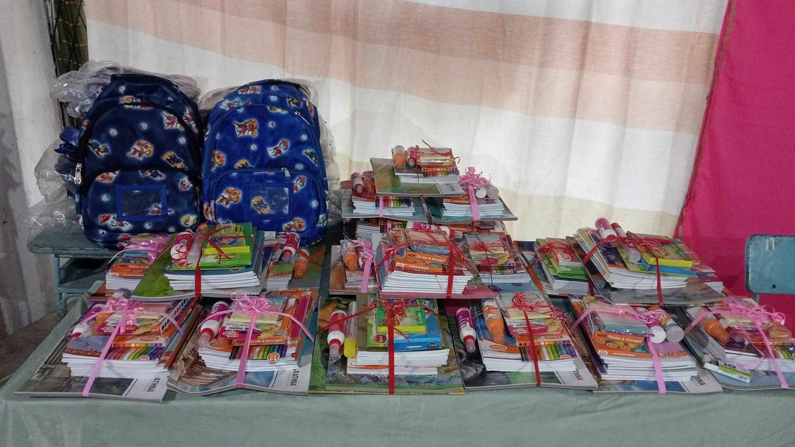 School bags and books being distributed to children in Sri Lanka